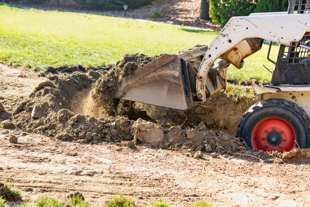 Skid steer grading and base excavation